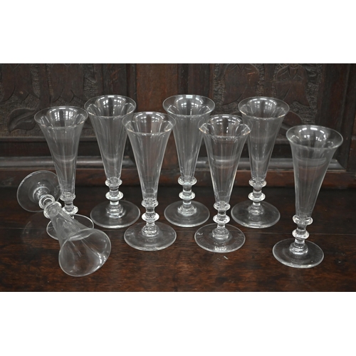 393 - A set of eight Georgian style ale glasses with conical bowls, on blade knop stems, the bases with gr... 