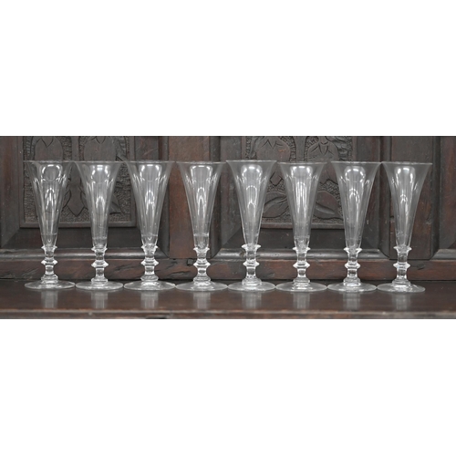 393 - A set of eight Georgian style ale glasses with conical bowls, on blade knop stems, the bases with gr... 