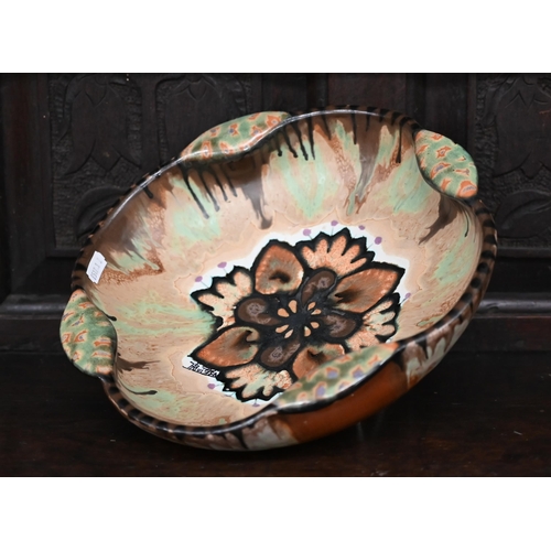 397 - A Paul Fouillen (Quimper) design studio pottery bowl with floral motif and streaked and marbled glaz... 