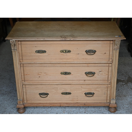4 - A continental pine three drawer chest, raised on ball feet, 111 cm x 55 cm x 86 cm h