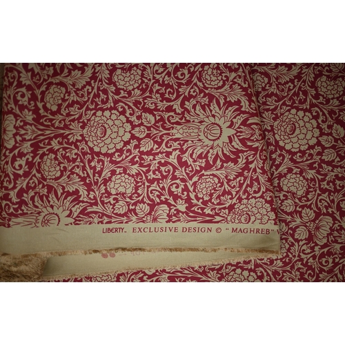 416 - A part roll of Liberty floral print fabric, to/w a part roll of wine-red dralon (2)