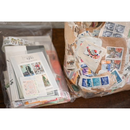 427 - A large quantity of loose postage stamps, SG album pages etc (box)