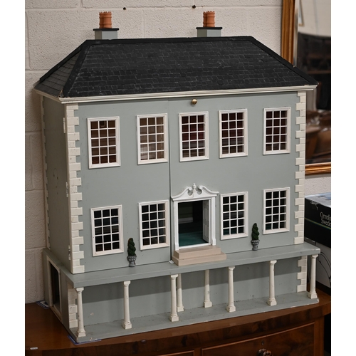 434 - A large painted mansion doll's house with slate roof, 110 cm high x 94 cm wide