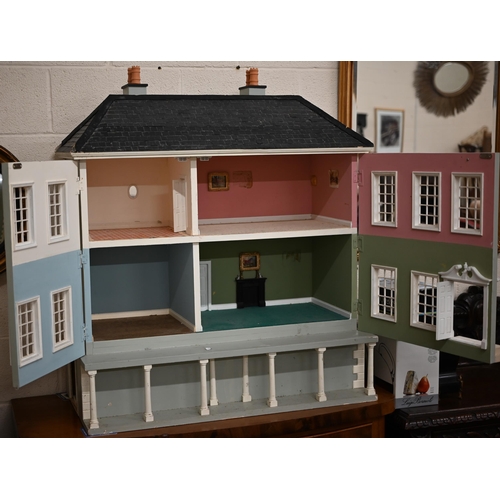 434 - A large painted mansion doll's house with slate roof, 110 cm high x 94 cm wide