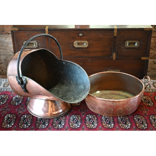 438 - A Victorian copper coal helmet, to/w a copper and brass preserving pan (2)