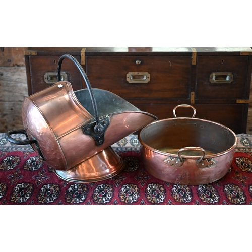 438 - A Victorian copper coal helmet, to/w a copper and brass preserving pan (2)