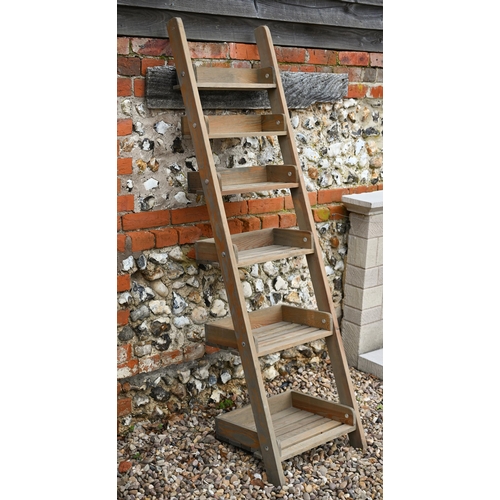 452 - A pine leaning rack of six slatted graduated shelves 