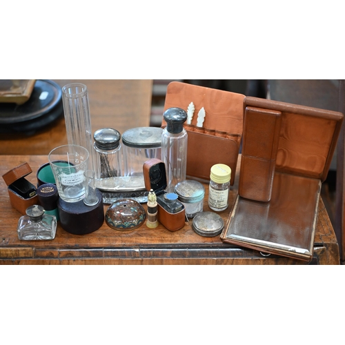 455 - A vintage pigskin toilet case partly-fitted, including some silver-mounted jars, etc with leather-tr... 