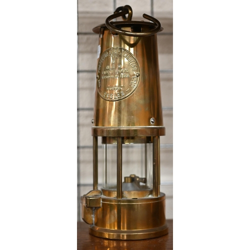 457 - A Protector Lamp and Lighting Co Ltd Type 6 miner's safety lamp to/w a carved walnut-cased aneroid b... 