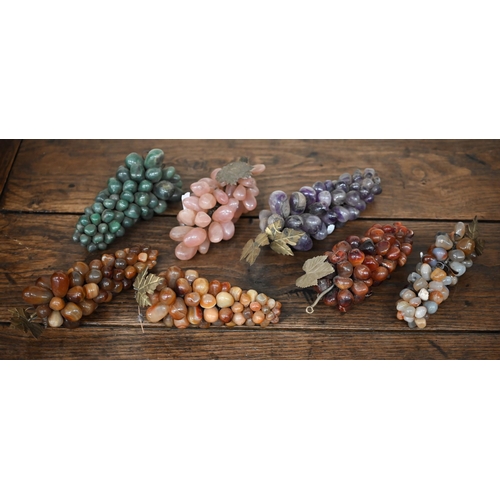 459 - Seven polished hardstone bunches of grapes