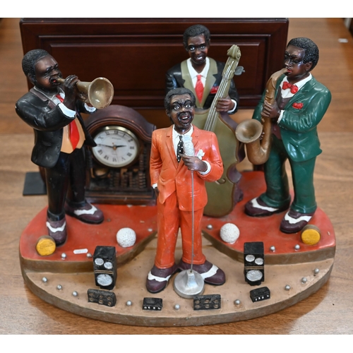 467 - A novelty plastic jazz group incorporating clock, 41 cm high x 57 cm wide