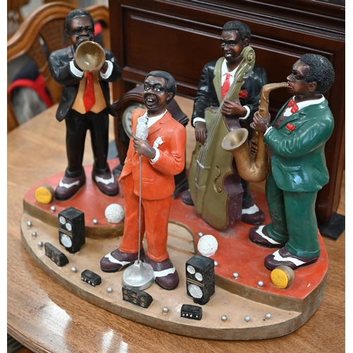 467 - A novelty plastic jazz group incorporating clock, 41 cm high x 57 cm wide