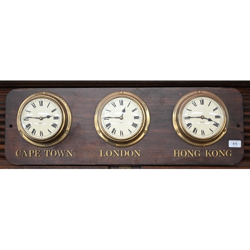 473 - A set of three ship's bulkhead clocks mounted on a plaque inscribed 'Cape Town' 'London' and 'Hong K... 