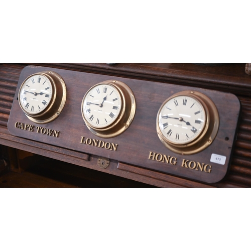 473 - A set of three ship's bulkhead clocks mounted on a plaque inscribed 'Cape Town' 'London' and 'Hong K... 