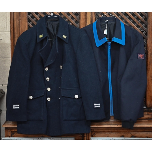 479 - A British Rail guard's uniform to/w over-jacket, tunic, another jacket and a long orange work-coat