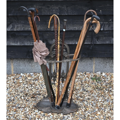 480 - A Victorian-style cast iron stick stand, to/w three silver-mounted sticks and various others