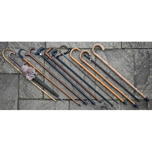 480 - A Victorian-style cast iron stick stand, to/w three silver-mounted sticks and various others