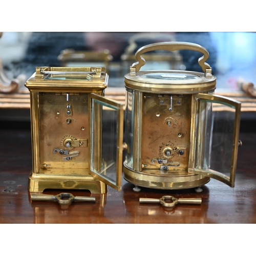 484 - Two vintage brass carriage clocks in leather travel cases