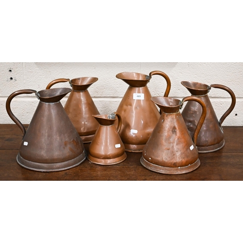 489 - Six antique conical copper rum-measures (6)