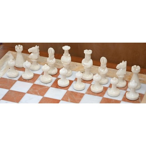 494 - An onyx and marble chessboard with chessmen