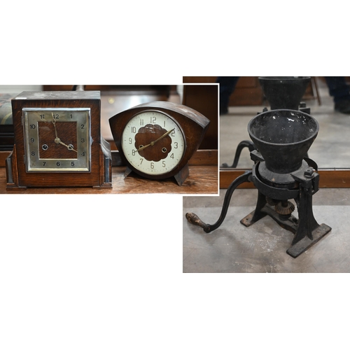 501 - A vintage cast iron large coffee/spice-grinder to/w two oak twin-train mantel clocks (3)