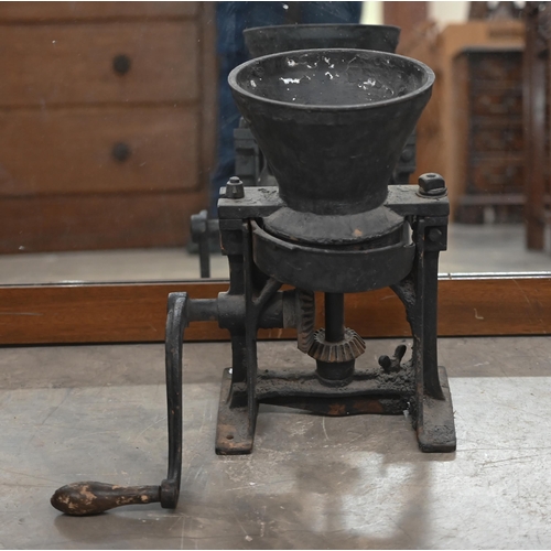 501 - A vintage cast iron large coffee/spice-grinder to/w two oak twin-train mantel clocks (3)