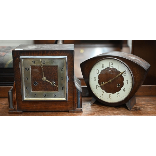 501 - A vintage cast iron large coffee/spice-grinder to/w two oak twin-train mantel clocks (3)