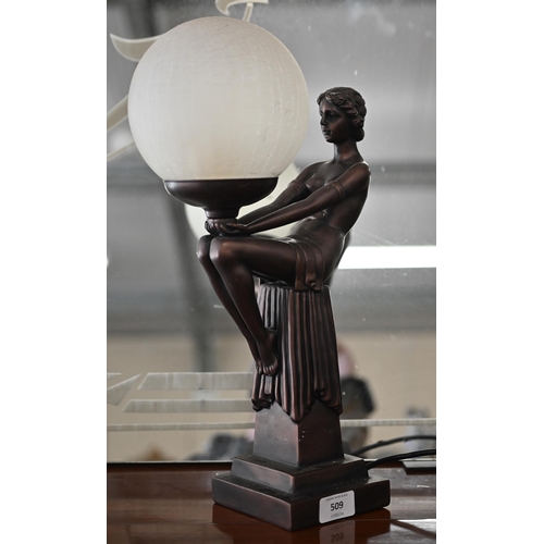 509 - An Art Deco cold-cast bronze figural table lamp with frosted glass globular shade, 42 cm high