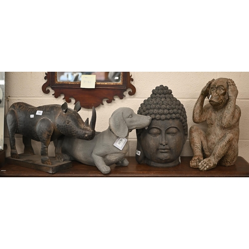 510 - A tin rhinoceros, 34 x 56 cm to/w a resin 'bronzed' monkey, a resin 'dachshund' flower trough and a ... 