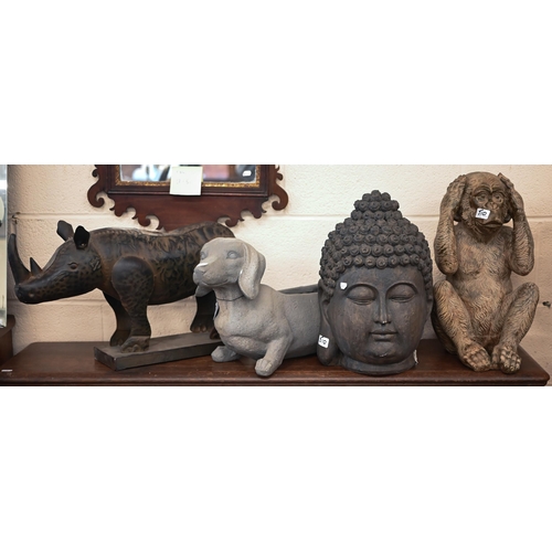 510 - A tin rhinoceros, 34 x 56 cm to/w a resin 'bronzed' monkey, a resin 'dachshund' flower trough and a ... 