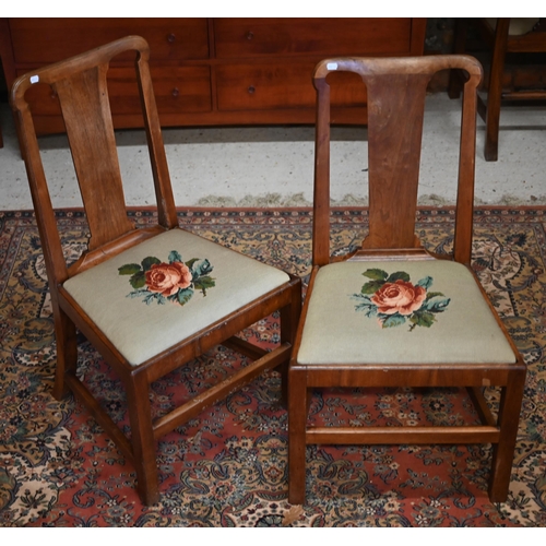 52 - #A set of six Georgian style mahogany dining side chairs, with green needlepoint floral seat pads (6... 