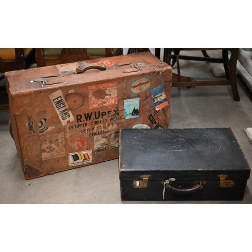 520 - A large vintage leather suitcase with various labels including Cunard White Star First Class and var... 