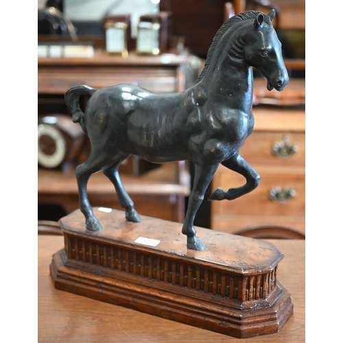 526 - A bronzed spelter figure of a pacing horse, in the 16th century manner, on walnut base, 49 x 43 cm o... 