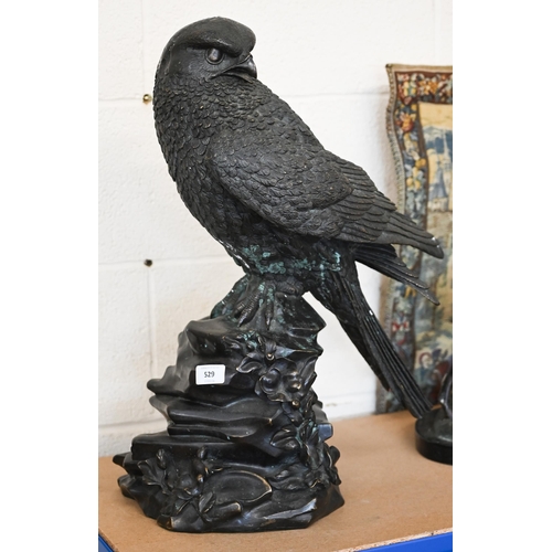 529 - A large bronzed eagle, perched on rocky outcrop, 57 cm high