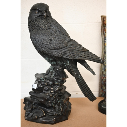 529 - A large bronzed eagle, perched on rocky outcrop, 57 cm high