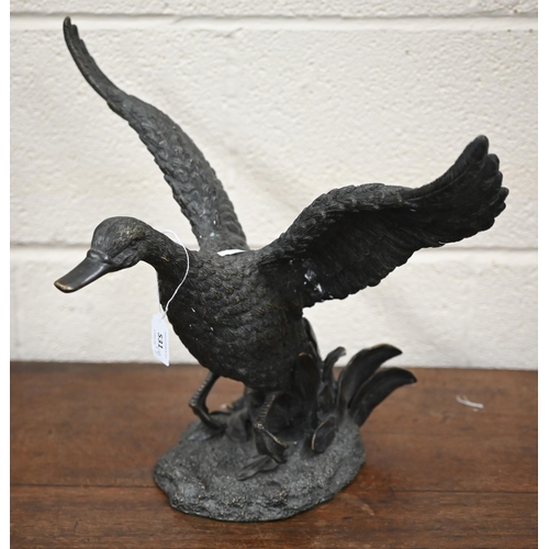 531 - A bronzed duck, taking off, 33 x 45 cm overall to/w a brass eagle and an Art Deco group of bronzed g... 