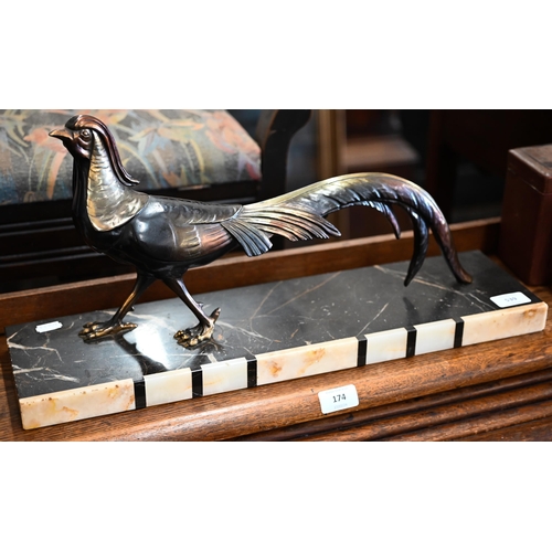 539 - An Art Deco bronzed pheasant, on marble and onyx base, 25 x 54 cm overall