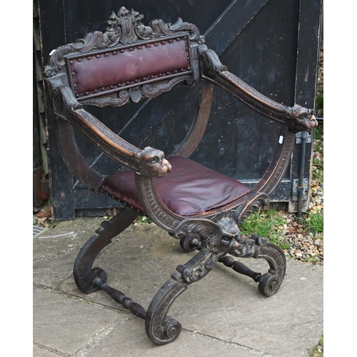 60 - A Victorian carved and moulded studded leather seat Bishops chair with dragon head arm terminals, on... 