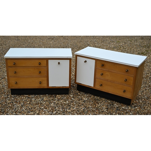 61 - A handed pair of low 1950s bedside cabinets, melamine and beech, designed by Laurence Olivier Archit... 