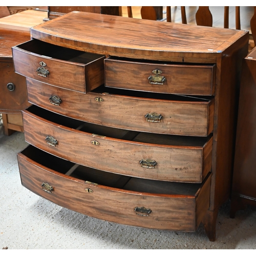 66 - A Victorian cross-banded mahogany chest of two short over three long graduated drawers, raised on sp... 