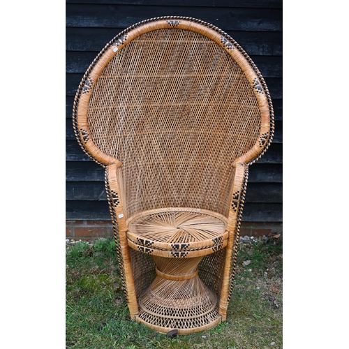 67 - A classic high fan back wicker chair circa 1970's