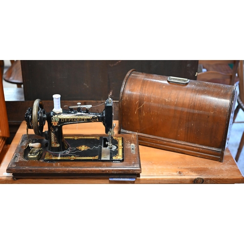 71 - #A vintage 'Defiance' brand hand crank sewing machine, in original wooden dome case