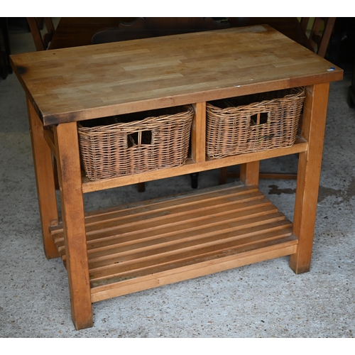 81 - A beech block kitchen island unit with two wicker basket drawers over a slatted open shelf, 109 cm x... 