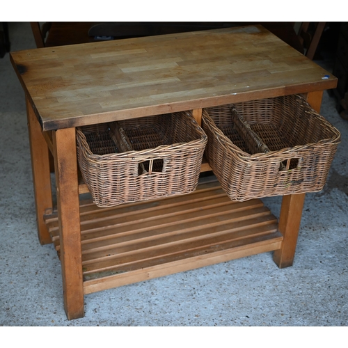 81 - A beech block kitchen island unit with two wicker basket drawers over a slatted open shelf, 109 cm x... 