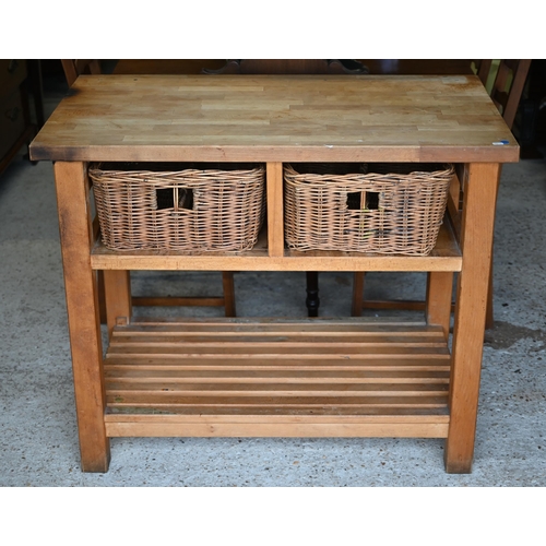 81 - A beech block kitchen island unit with two wicker basket drawers over a slatted open shelf, 109 cm x... 