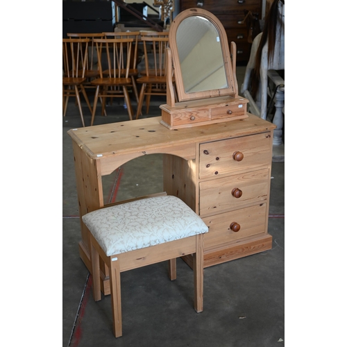 90 - A seven piece pine bedroom suite, comprising a desk; a mirror; stool; a chest of three short over th... 