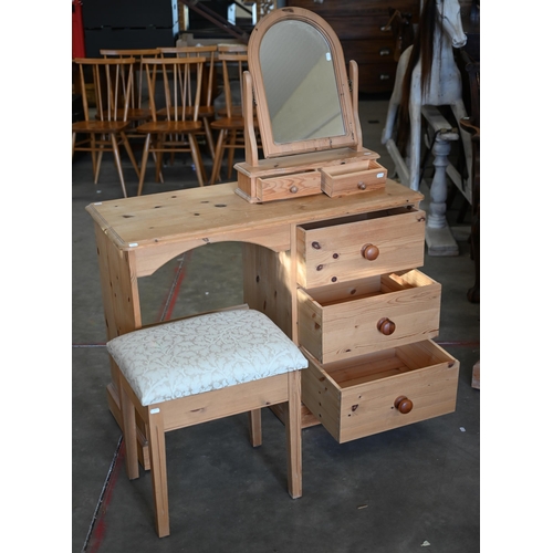 90 - A seven piece pine bedroom suite, comprising a desk; a mirror; stool; a chest of three short over th... 