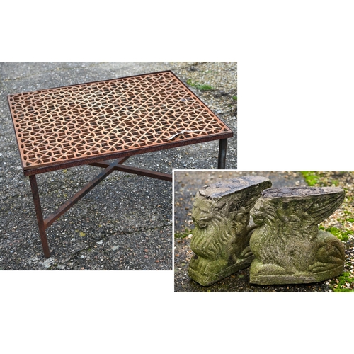 112 - A weathered cast iron 'grate' coffee table within a steel frame raised on cross stretchers to/w a pa... 