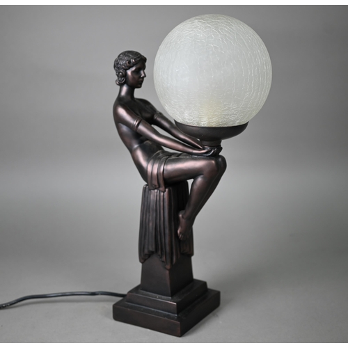 509 - An Art Deco cold-cast bronze figural table lamp with frosted glass globular shade, 42 cm high