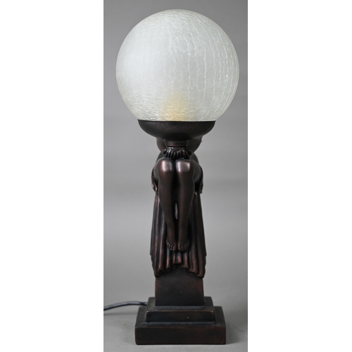 509 - An Art Deco cold-cast bronze figural table lamp with frosted glass globular shade, 42 cm high